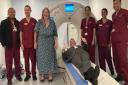 Cllr Darren Rodwell, Cllr Maureen Worby and medical staff around the recently installed mobile CT scanner at Barking Community Hospital