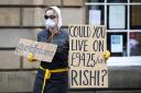A demonstrator protests about the UK Government sick pay allowance of £94 per week for freelance and self employed workers during the coronavirus outbreak. Picture: PA/Jane Barlow