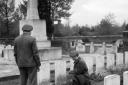 Soldiers inspect graves at the South African First World War cemetery at Delville Wood, 13 November 1944. Photo: Imperial War Museum