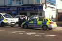 Police attending the scene in High Road, Ilford.
