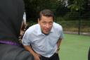 Former West Ham player Tony Cottee talking to pupils from Isacc Newton Academy at the new games area in South Park in Ilford