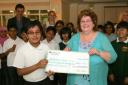 The school handing over donation to Wiltshire Court.
Vishal Sharma, 11 with Barbara Lowe from Wiltshire Court.