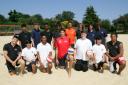 Chris Gregory, centre, taught Palmer Catholic Academy students how to play beach volleyball at Loxford Park