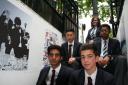 The young artists from Chigwell School with their work on display in the West End.