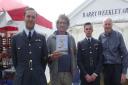 Richard Smith, second from left, with his new book Kenley Scramble and members of the RAF and artist Barry Weekley at Biggin Hill. Picture: Richard Smith