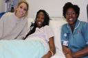 Stacey Solomon with patient Mary Ayinde and haemoglobinopathy nurse Shola Shoyemi at Queen's Hospital, Romford. Picture: BHRUT