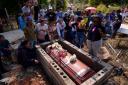 People mourn the death of miner Santiago Mora (Ariana Cubillos/AP)