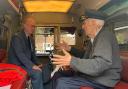 Albert Gibbs talks to Craig Henty in the back of a vintage London ambulance