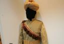 First World War uniform from India on display with a rifle at Redbridge Museum's First World War exhibition