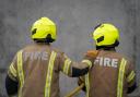 A high road in Goodmayes has been closed due to a building fire