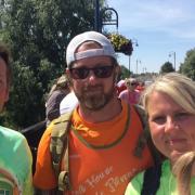 (From L to R) Rob Stringer, co-founder of Hector's House, George Downey and Cindy Downey during the walk to St Neots