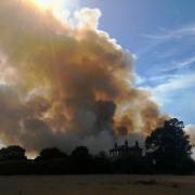 Smoke billows from the grass fire in Oaks Lane, Newbury Park