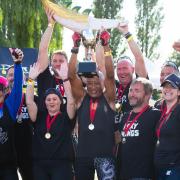 The Tribal Warriors celebrate winning the 2022 St Neots Charity Dragon Boat Race
