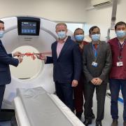 Flanked by hospital staff, Wes Streeting MP (left) and Sam Tarry MP (right) cut the ribbon on King George Hospital's new CT scanner