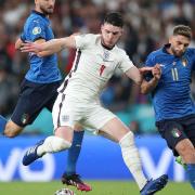 England's Declan Rice (centre) battles with Italy's Bryan Cristante (left) and Domenico Berardi during the UEFA Euro 2020 Final at Wembley Stadium, London. Picture date: Sunday July 11, 2021.