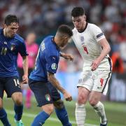England's Declan Rice (right) battles with Italy's Giovanni Di Lorenzo (centre) and Federico Chiesa during the UEFA Euro 2020 Final at Wembley Stadium, London. Picture date: Sunday July 11, 2021.