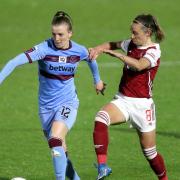 West Ham United's Kate Longhurst (left) and Arsenal's Jordan Nobbs battle for the ball during the FA Women's Super League match at Meadow Park, Borehamwood. Picture date: Wednesday April 28, 2021.