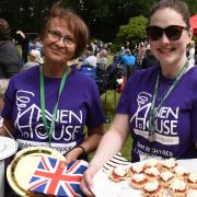 Volunteers Gail Hewett and Victoria Claridge serve up some scones