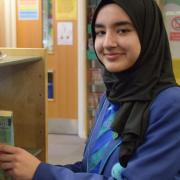 Loxford School pupil Aisha Qayyum volunteered to help young children with reading