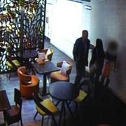 A CCTV image of John Bancroft at an unnamed hotel with two victims