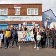 'Save our Street' banners were held aloft by demonstrators outside City Plumbing Ltd