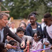 TV presenter Ben Shephard opens the revamped playground at Haven House with help from children.