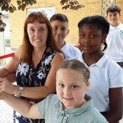 Headteacher Penny Martin opens the memorial garden with Mossford Primary School pupils