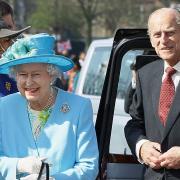 Queen Elizabeth II and the Duke of Edinburgh during a visit to Waltham Forest Town Hall, as part of the Queen's Diamond Jubilee tour