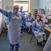 Nurses hold a meeting on a Covid-19 ward
