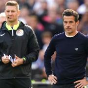 Fulham manager Marco Silva looks on with fourth official Robert Jones at London Stadium