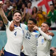 Declan Rice, Jude Bellingham and Phil Foden celebrate during England's 3-0 win over Wales