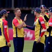 Daniel Sams celebrates a wicket with Essex teammates during the 2022 season
