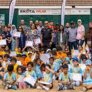 Volunteers from Ilford's Ekota Academy and children they help