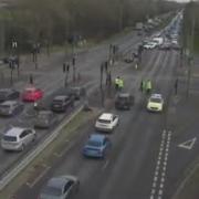 Police cars block the A12