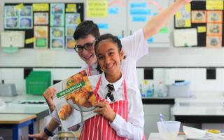 Students, along with parents and staff, contributed recipes to the community cookbook